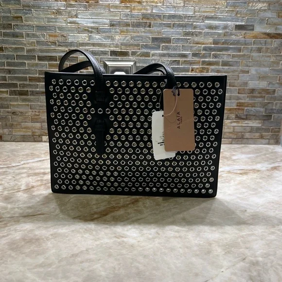 ALAÏA Mina Small perforated leather tote bag - Picture 10 of 14